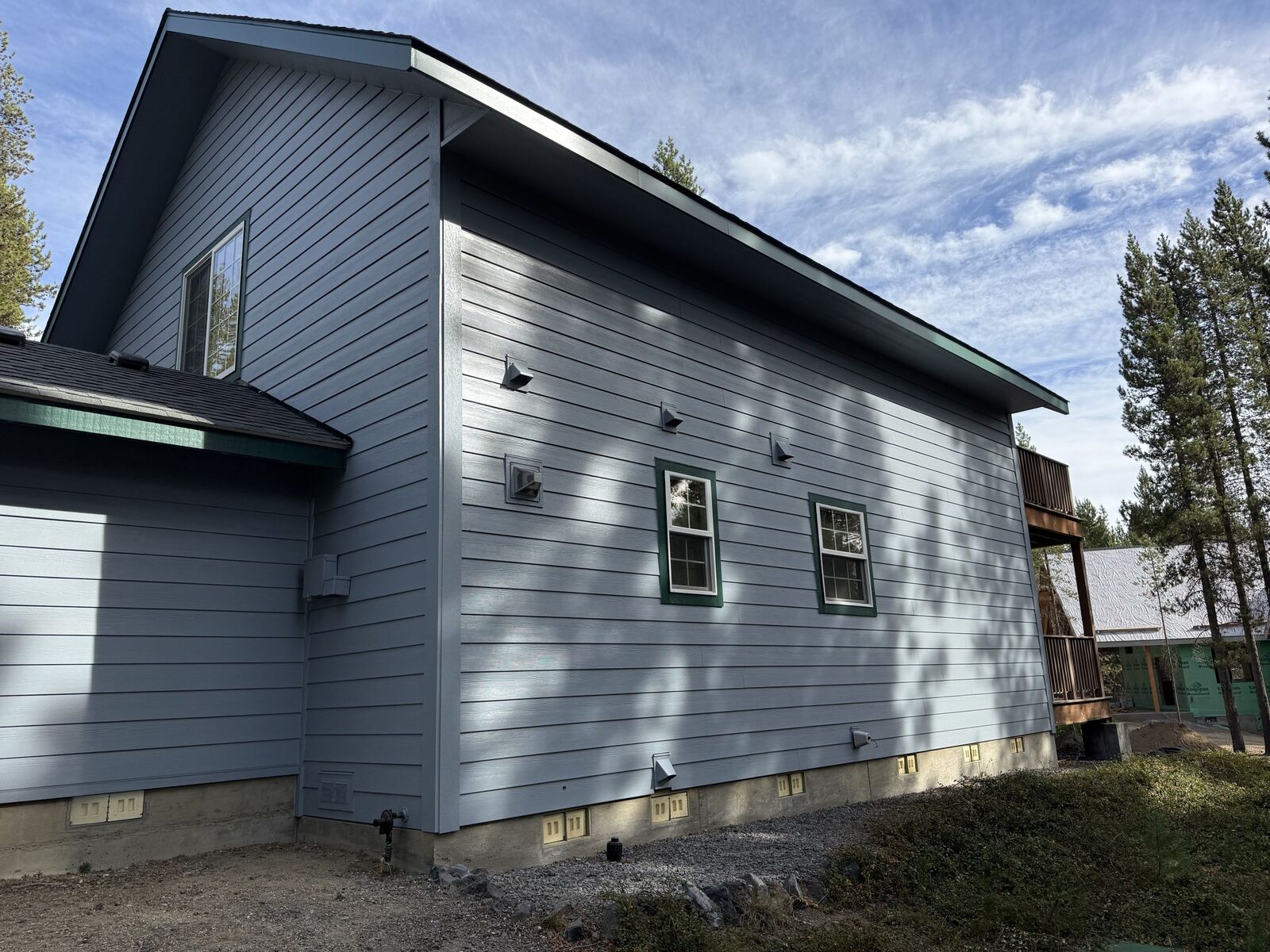 Finished HardiePlank lap siding re-side on a two-story Crescent Lake home