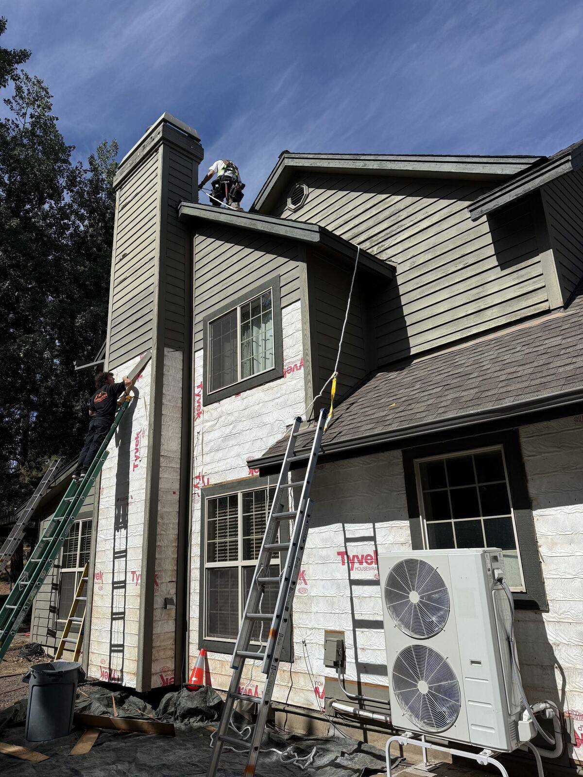 Siding opened up on a chimney chase during a repair